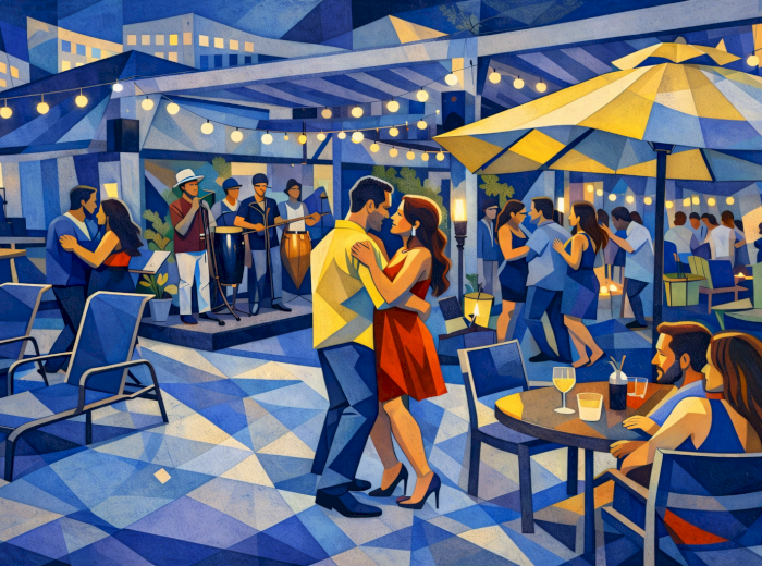 People are dancing and socializing at a vibrant outdoor venue with live music, lights, and tables under umbrellas in a lively atmosphere.